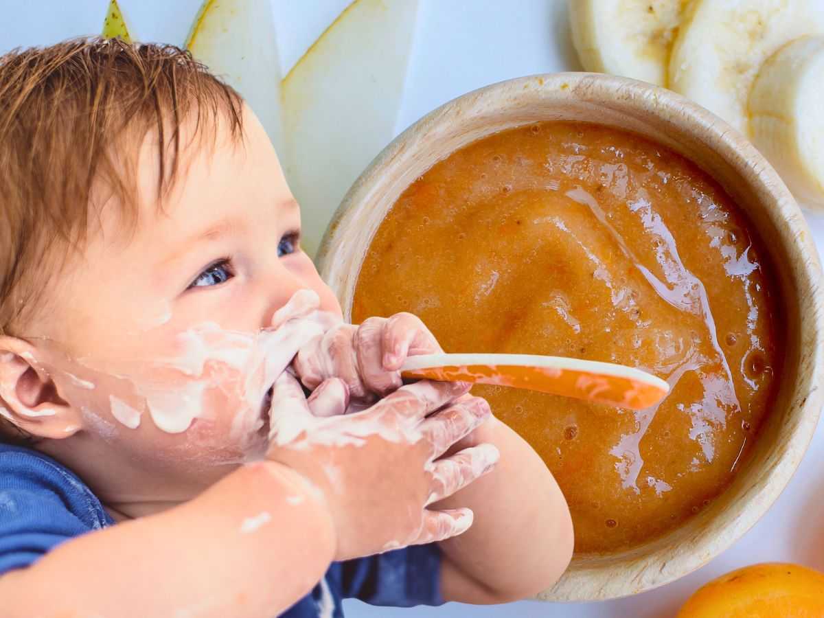 Sfondo ciotola con pappetta e bambino che mangia con cucchiaio in bocca