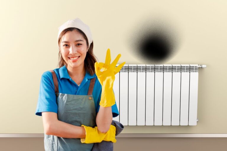 macchia nera dietro termosifone e donna che fa ok